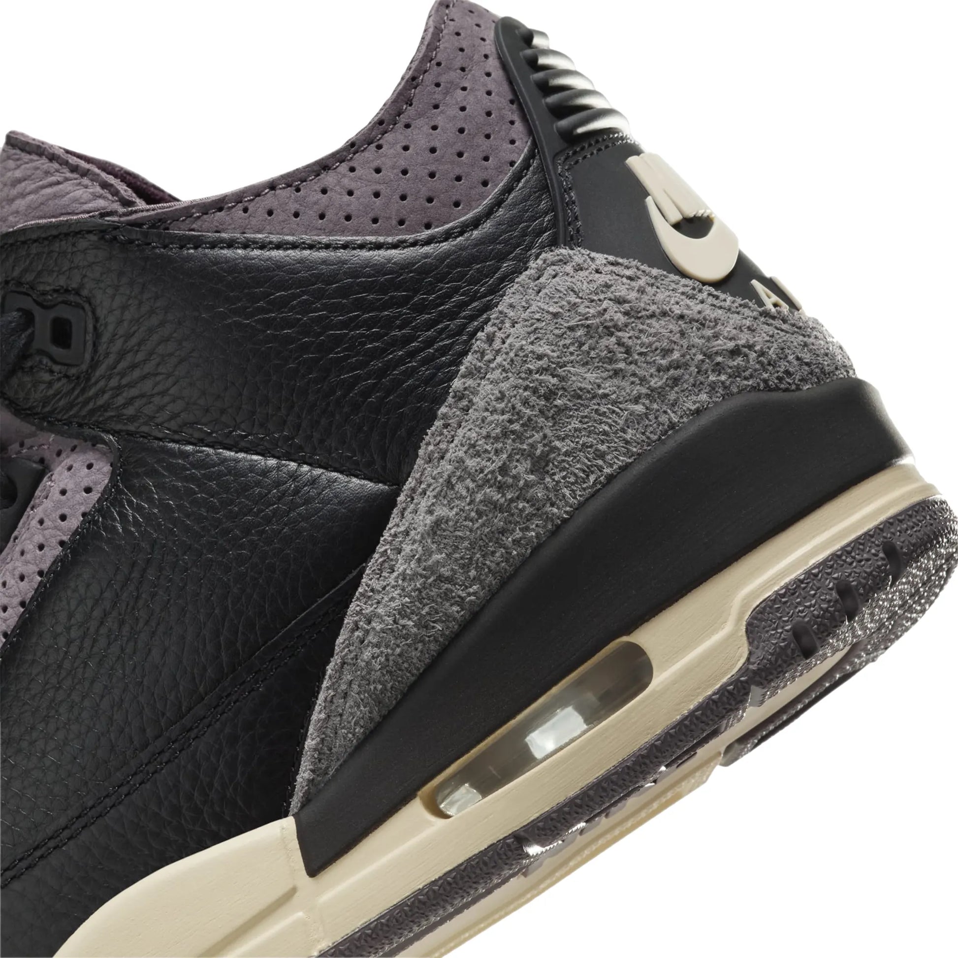 A Ma Maniére x Air Jordan 3 Retro Black Violet Ore (W) features a sleek design with a dark color palette and off-white midsole.