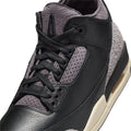 A Ma Maniére x Air Jordan 3 Retro Black Violet Ore (W) features a sleek dark design with an off-white midsole.